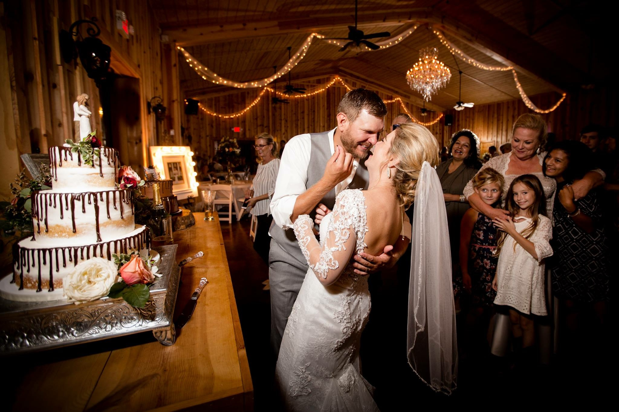 Couple dancing in the warmly lit event hall